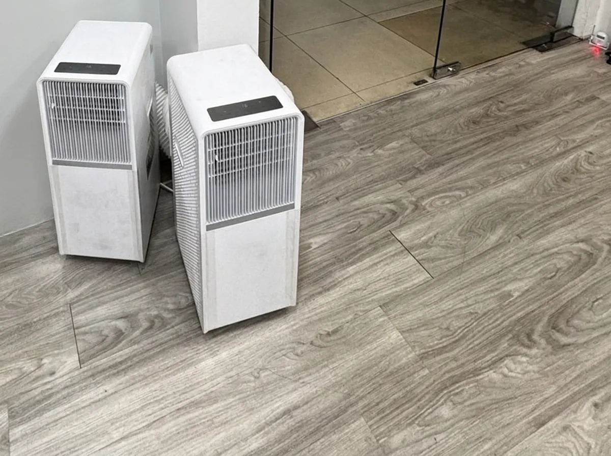 AANRS portable aircon rental Singapore, two units on a real client job at a shop doorway